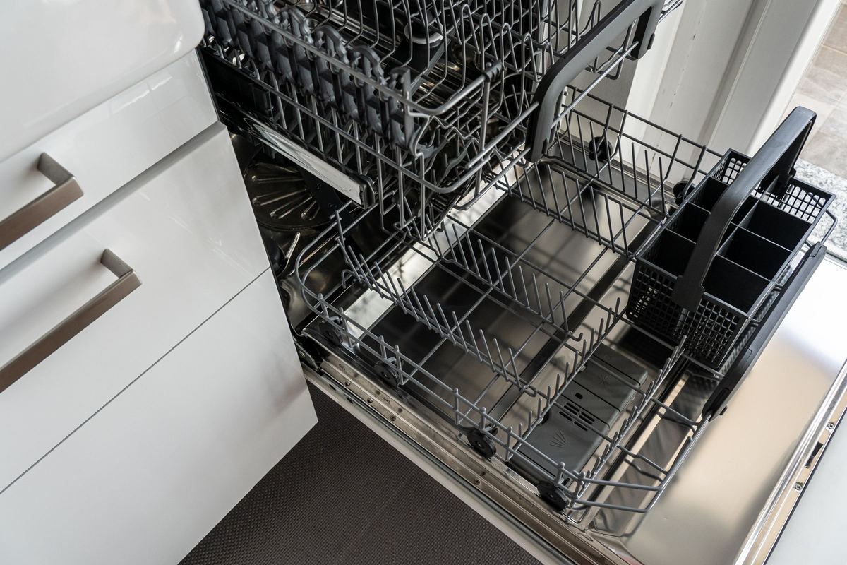 Built-in dishwasher with the lower rack pulled out