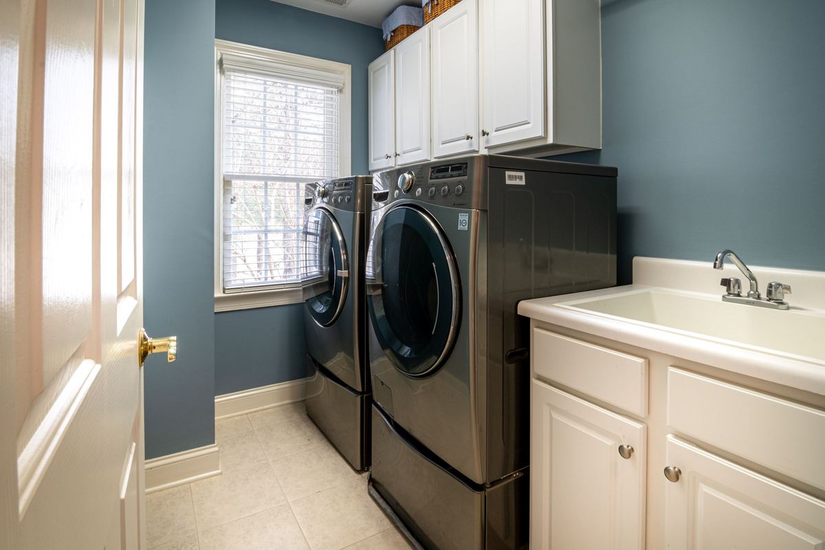Laundry room with a front-loading washer and tumble dryer