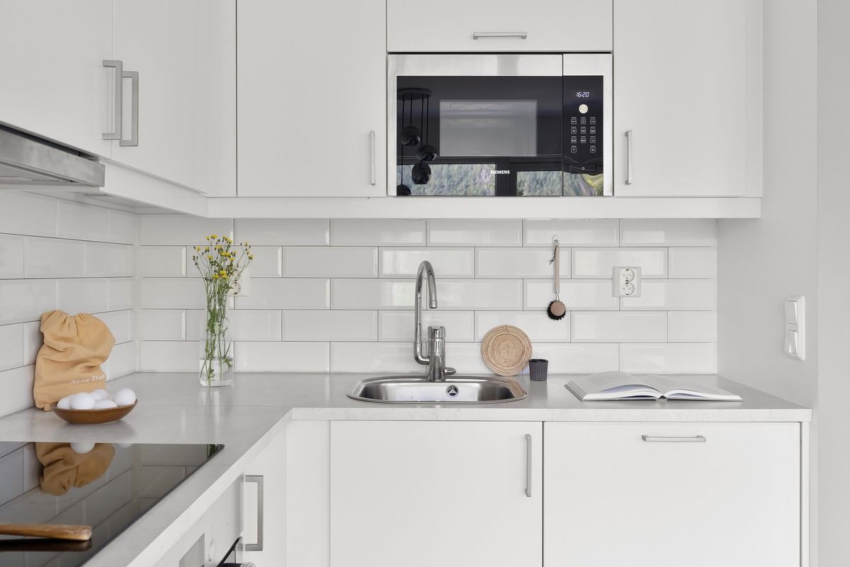 Built-in microwave in a white kitchen