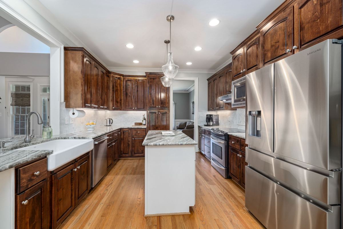 Modern kitchen with a stainless steel French-door fridge, dishwasher and range