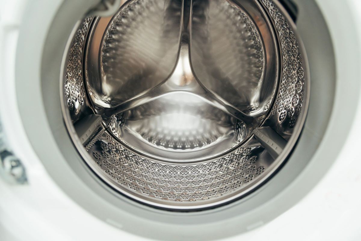 Close-up of a stainless steel washing machine drum